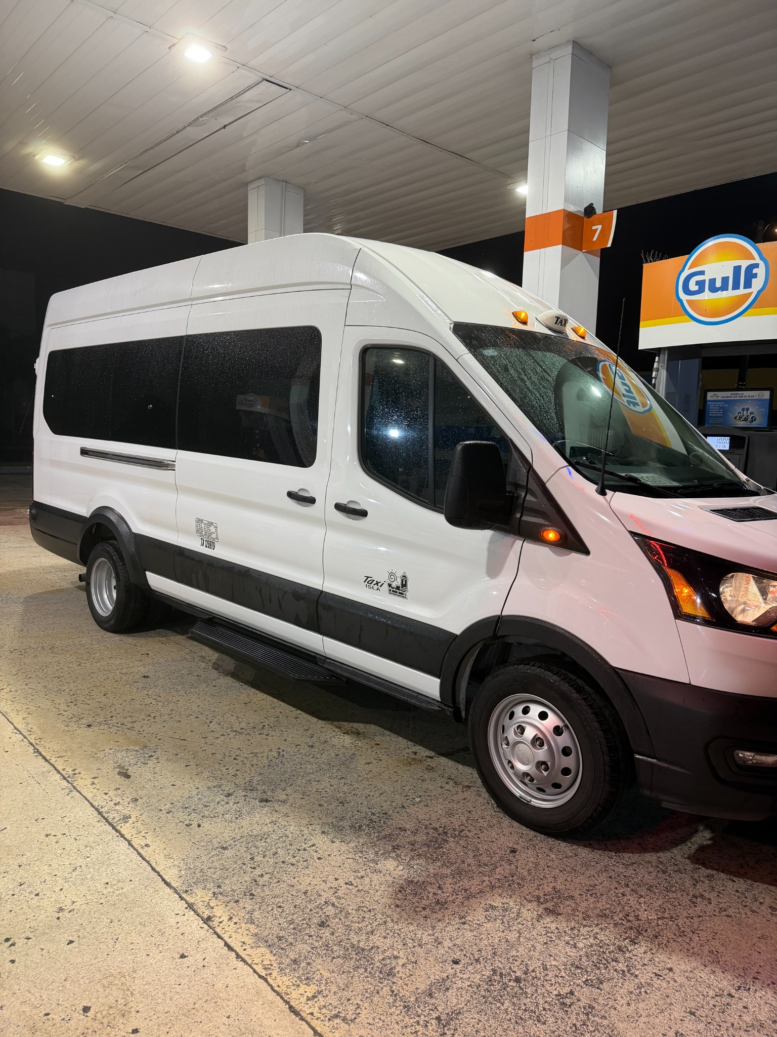 Our white Ford Transit passenger van